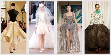 four fashionable women wearing unique designer dresses on a runway haute couture