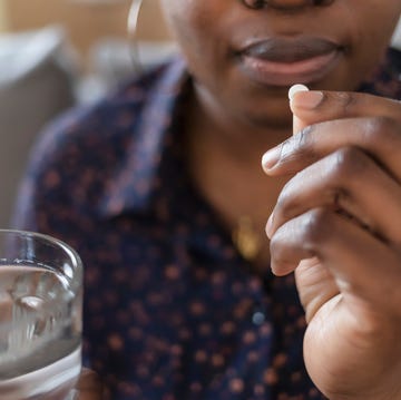 woman taking pill