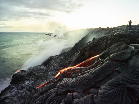 hawaii, big island, hawai'i volcanoes national park, lava flowing into pacific ocean, photographer