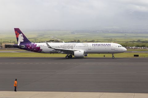 A Hawaiian Airlines plane waiting in line to take off