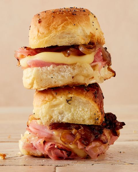 stack of hawaiian roll sliders with ham, caramelized onions, and swiss cheese