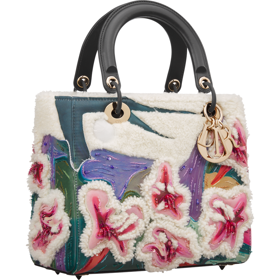 a dior handbag featuring intricate embroidered floral designs in vibrant colors