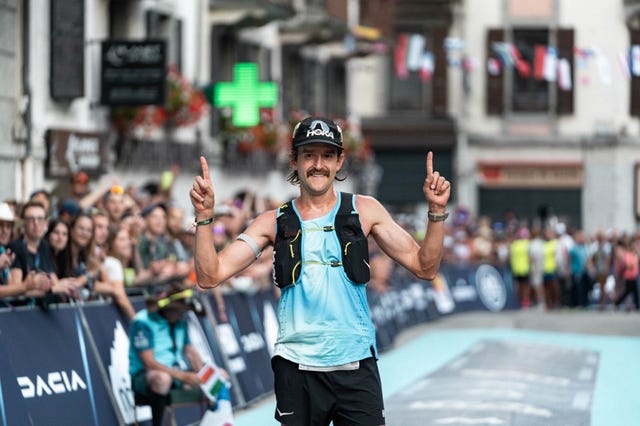 runner celebrating at the finish line of a race