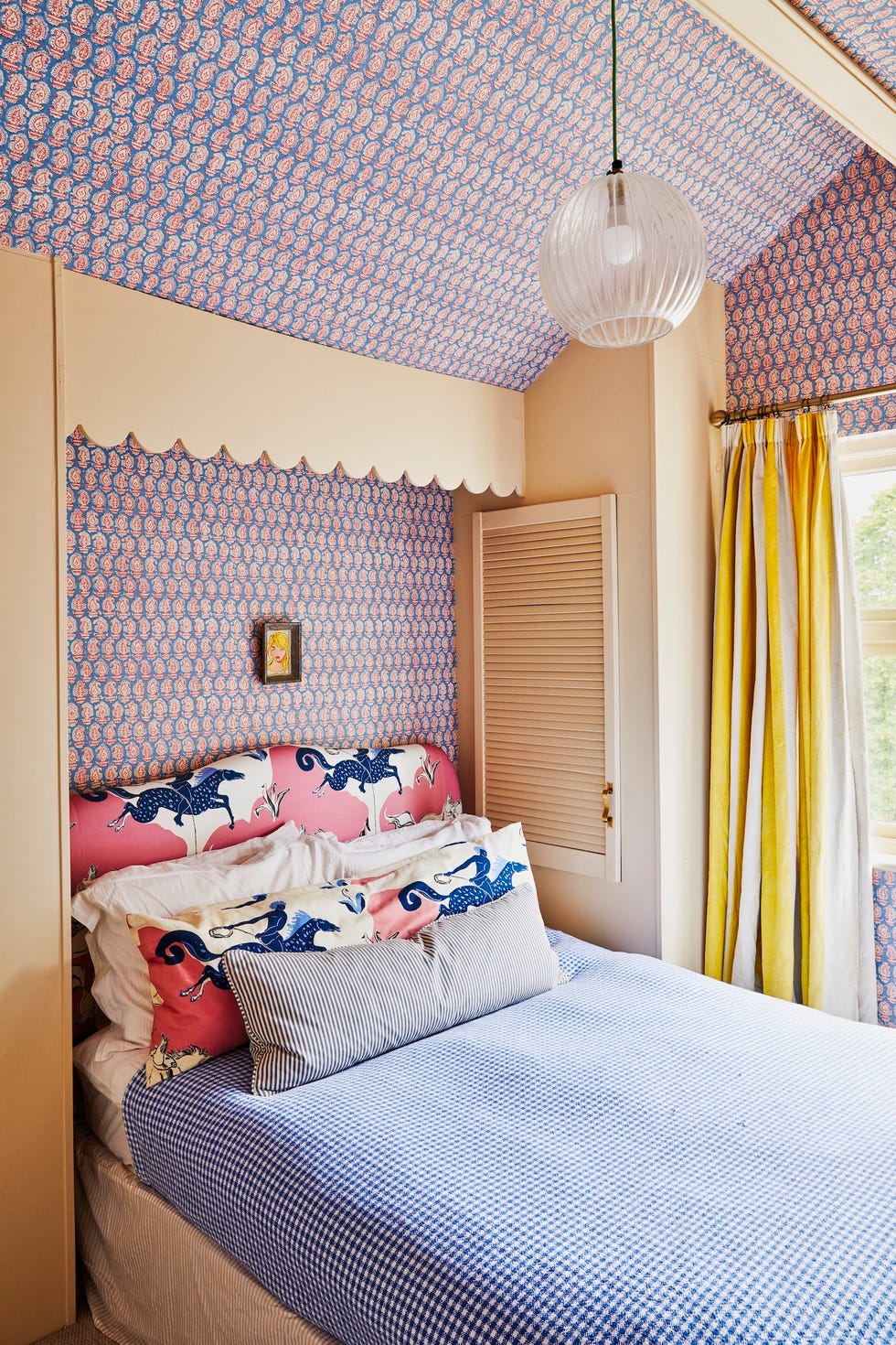 Nottingham flat tour a bed with wallpapered walls and ceiling