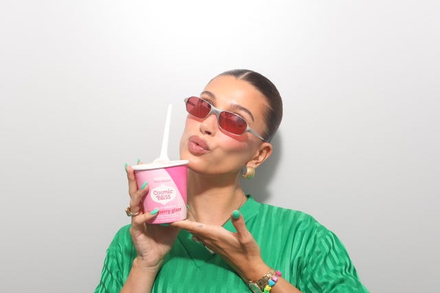 a person holding a box of milk