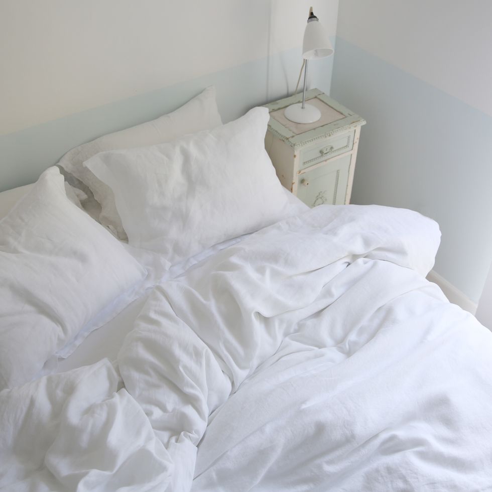 White, Bed sheet, Bedding, Bedroom, Room, Bed, Furniture, Duvet cover, Bed frame, Textile, 