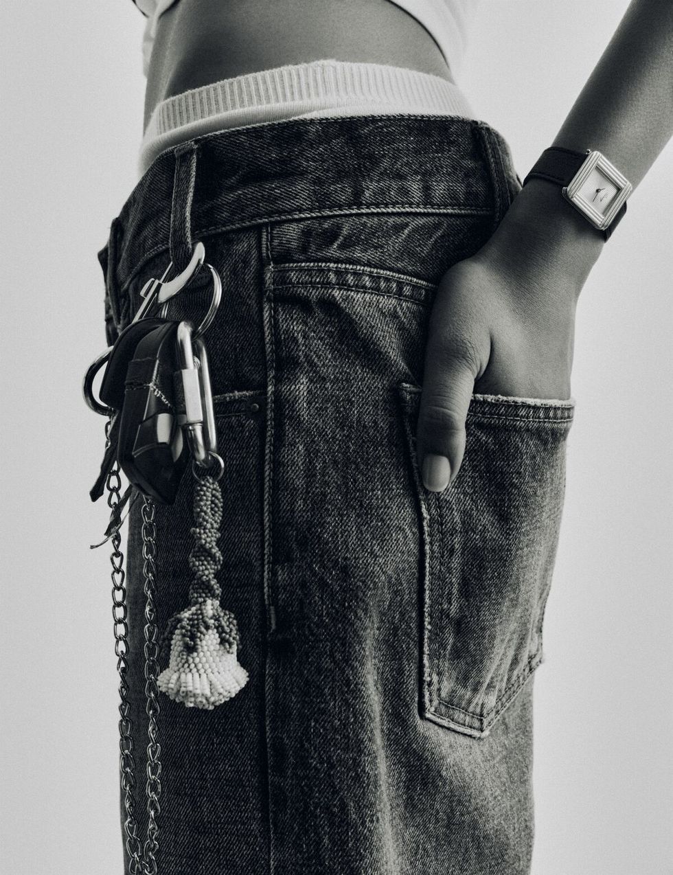 a person holding a pair of jeans
