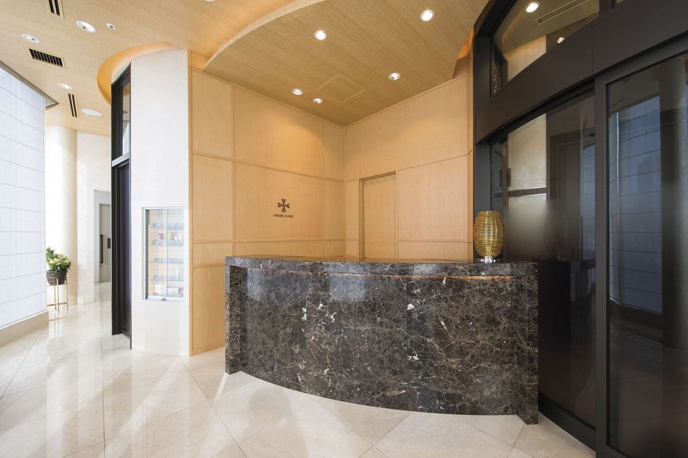 a large bathroom with a large marble counter