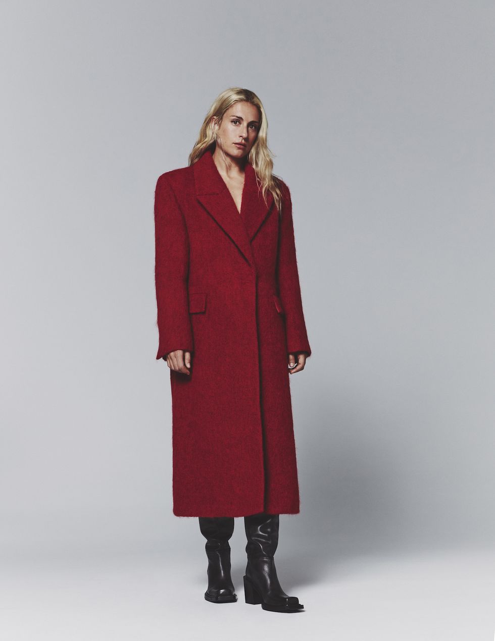 a woman in a red coat