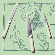 material kitchen knives on illustrated cutting board