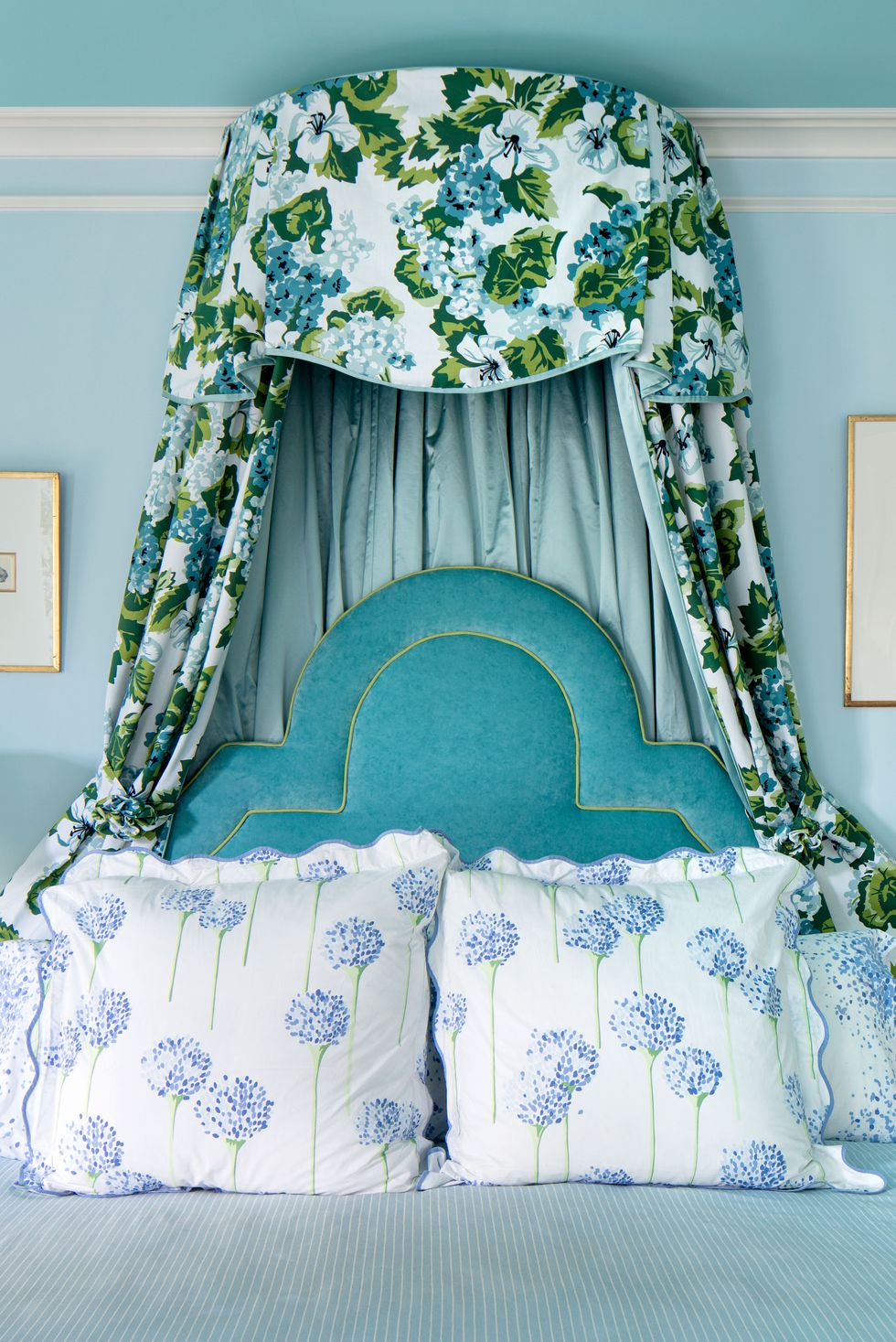 a bed with a flowered headboard