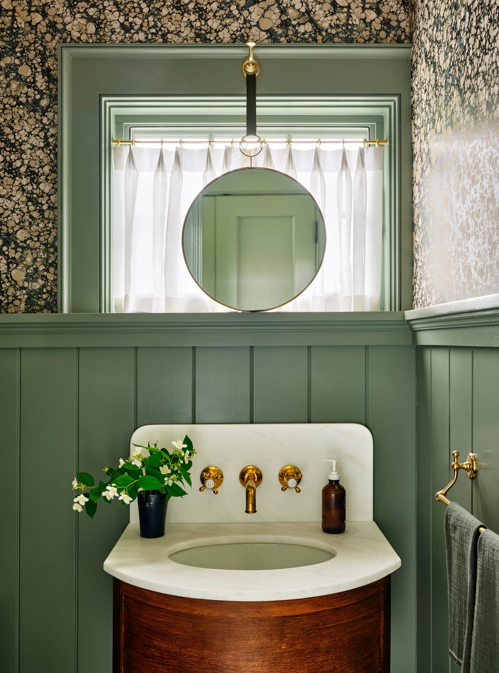 tiny powder room designed by chauncey boothby