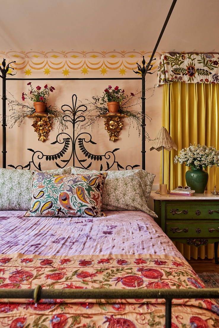 A cozy bedroom featuring a decorative bed colorful textiles and plants A cozy bedroom featuring a decorative bed colorful textiles and plants