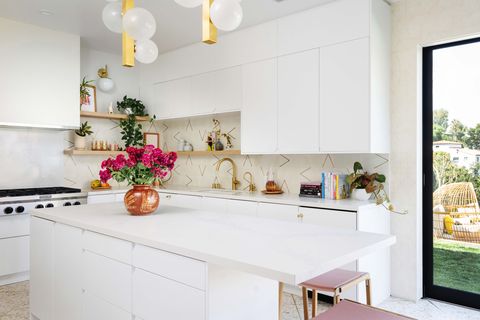 white cabinets, pink stools