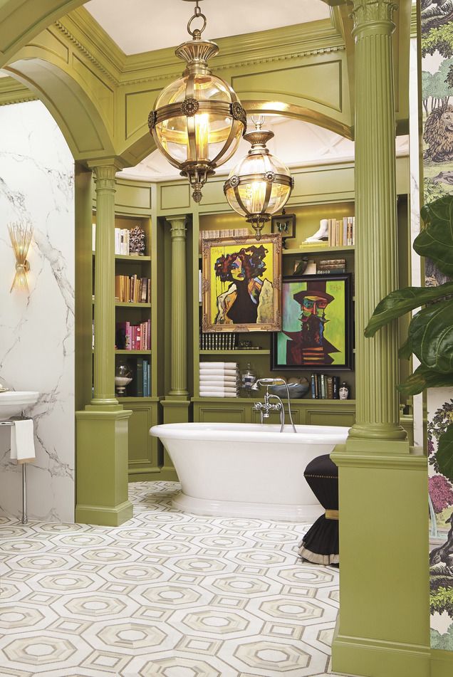 reading room with fully stocked built in shelves and tub side perches for a glass of wine or cup of tea, this otherworldly bathroom by corey damen jenkins is also a library amid the art deco–inspired tilework, greek revival columns and arches, and bold artwork animating the bathtub alcove, every stylistic flourish hits the mark floor tiles walker zanger tub dxv wallpaper cole  son green paint medieval times, benjamin moore