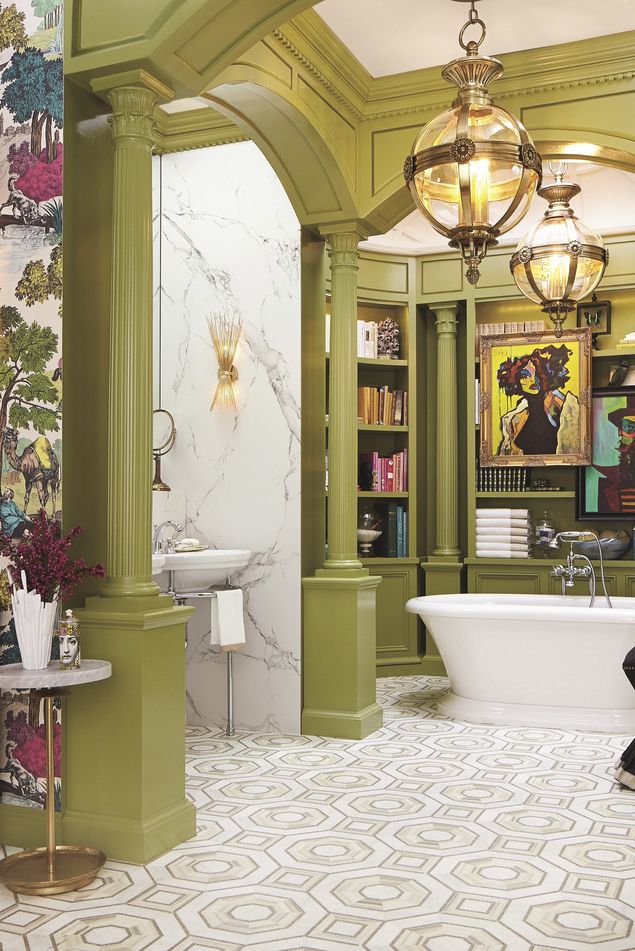 reading room with fully stocked built in shelves and tub side perches for a glass of wine or cup of tea, this otherworldly bathroom by corey damen jenkins is also a library amid the art deco–inspired tilework, greek revival columns and arches, and bold artwork animating the bathtub alcove, every stylistic flourish hits the mark floor tiles walker zanger tub dxv wallpaper cole  son green paint medieval times, benjamin moore