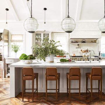 white kitchen with herringbone floors