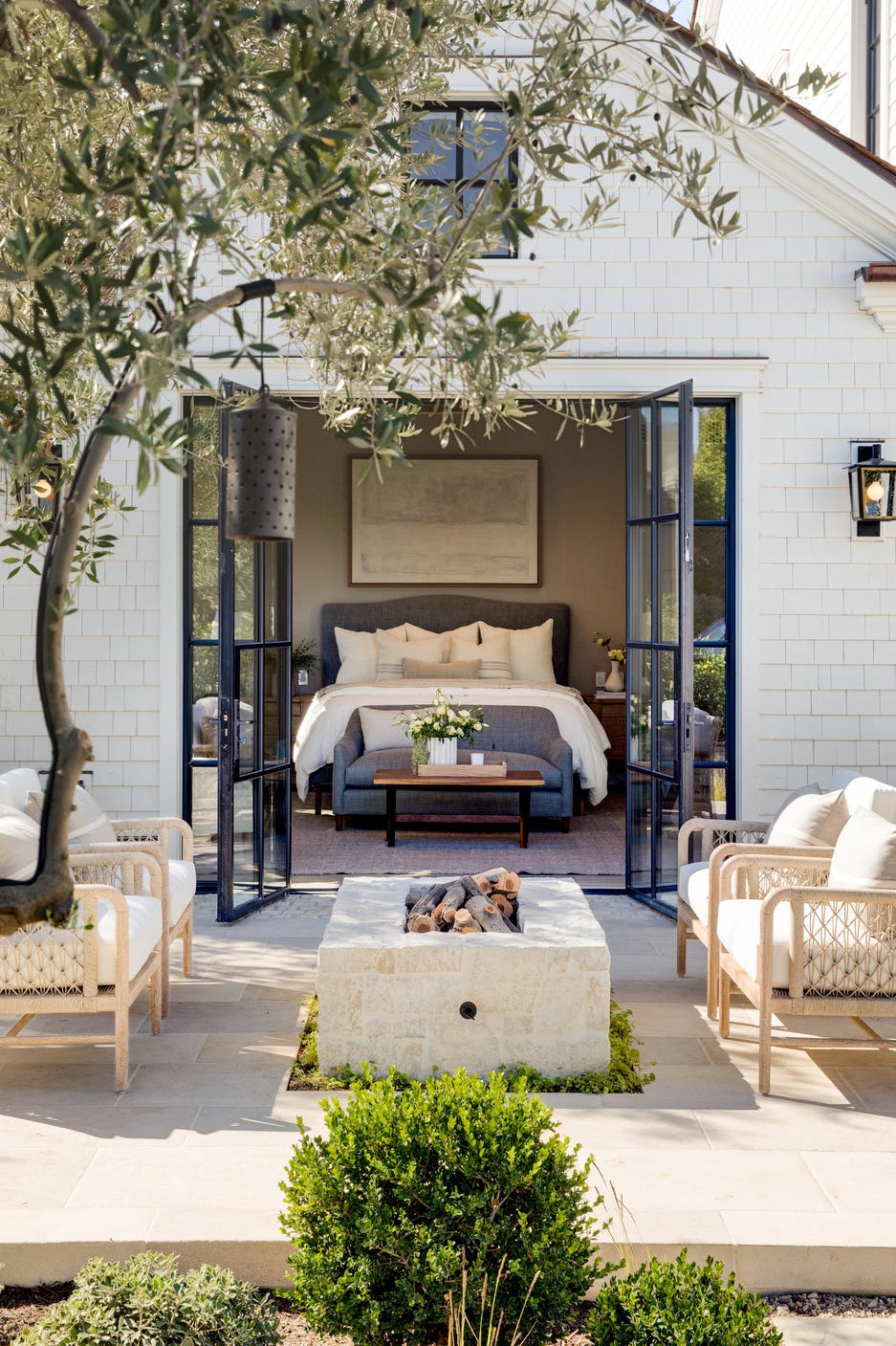this sandstone patio, just beyond the glass doors of a bedroom by designer brooke wagner, is outfitted with palecek seating and a custom fireplace for enjoying the southern california climate durable, sedimentary rock pavers like these can be sourced in a wide color range to suit any style this sandstone patio, just beyond the glass doors of a bedroom by designer brooke wagner, is outfitted with palecek seating and a custom fireplace for enjoying the southern california climate durable, sedimentary rock pavers like these can be sourced in a wide color range to suit any style