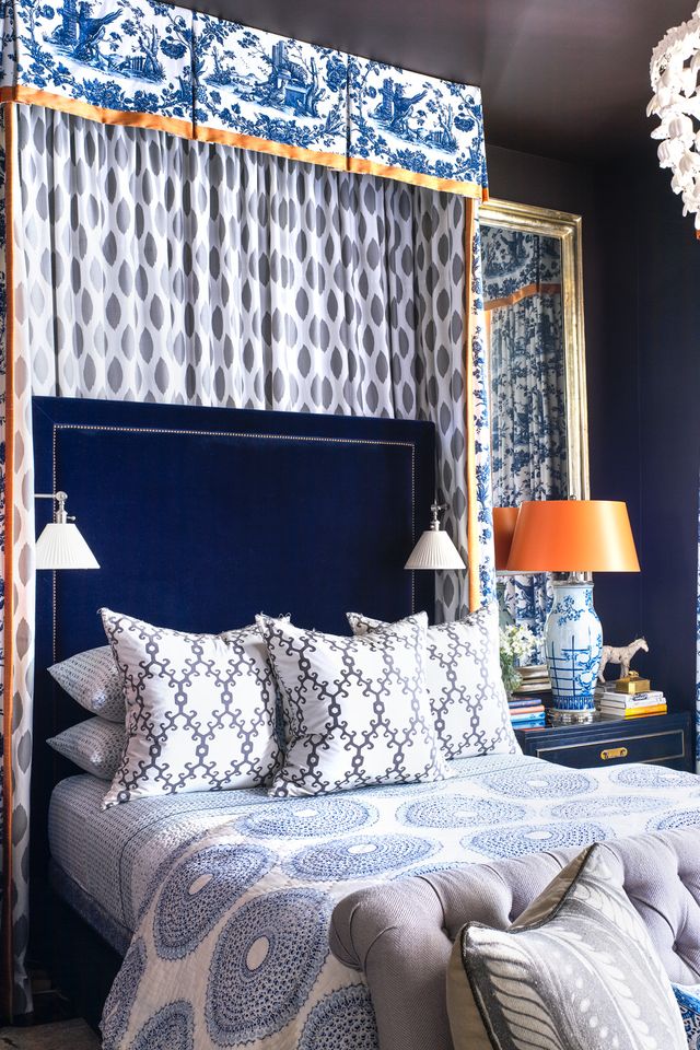 a bed with a blue and white bed spread