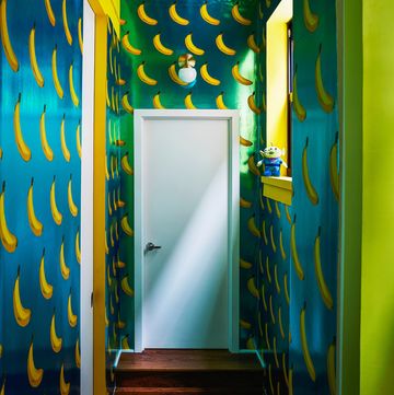 hallway with blue and yellow banana wallpaper