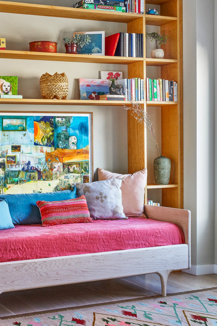 Reading corner, reading nook, children's room, nursery, study by Indigo Ochre Design's Karon Studio, daybed surrounded by custom-made bookshelves