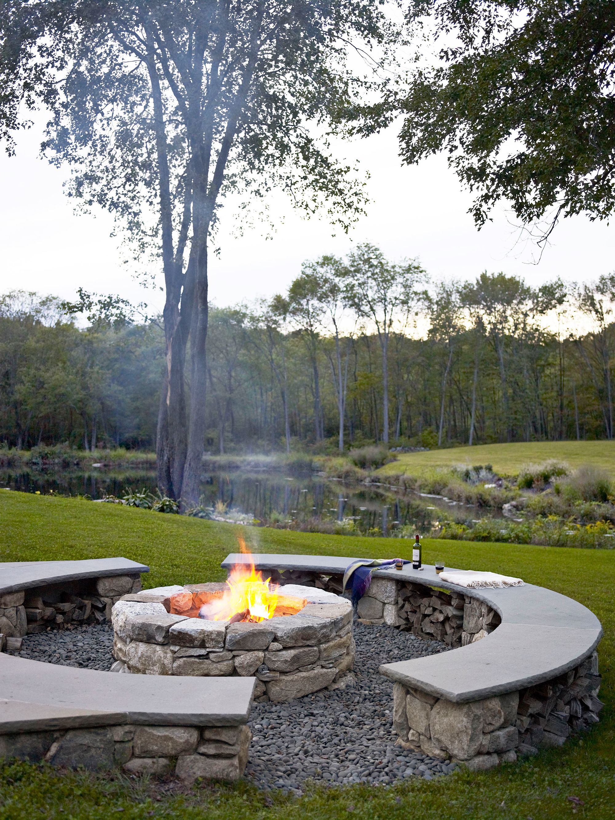 Concrete effect fire online pit with log store