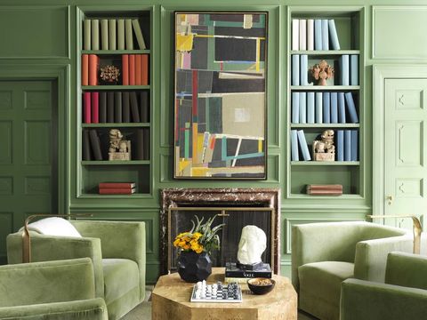 green library, fireplace, stone coffee table