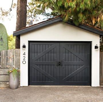 detached garage with gravel driveway