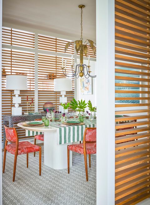 dining room with louvered oak panels
