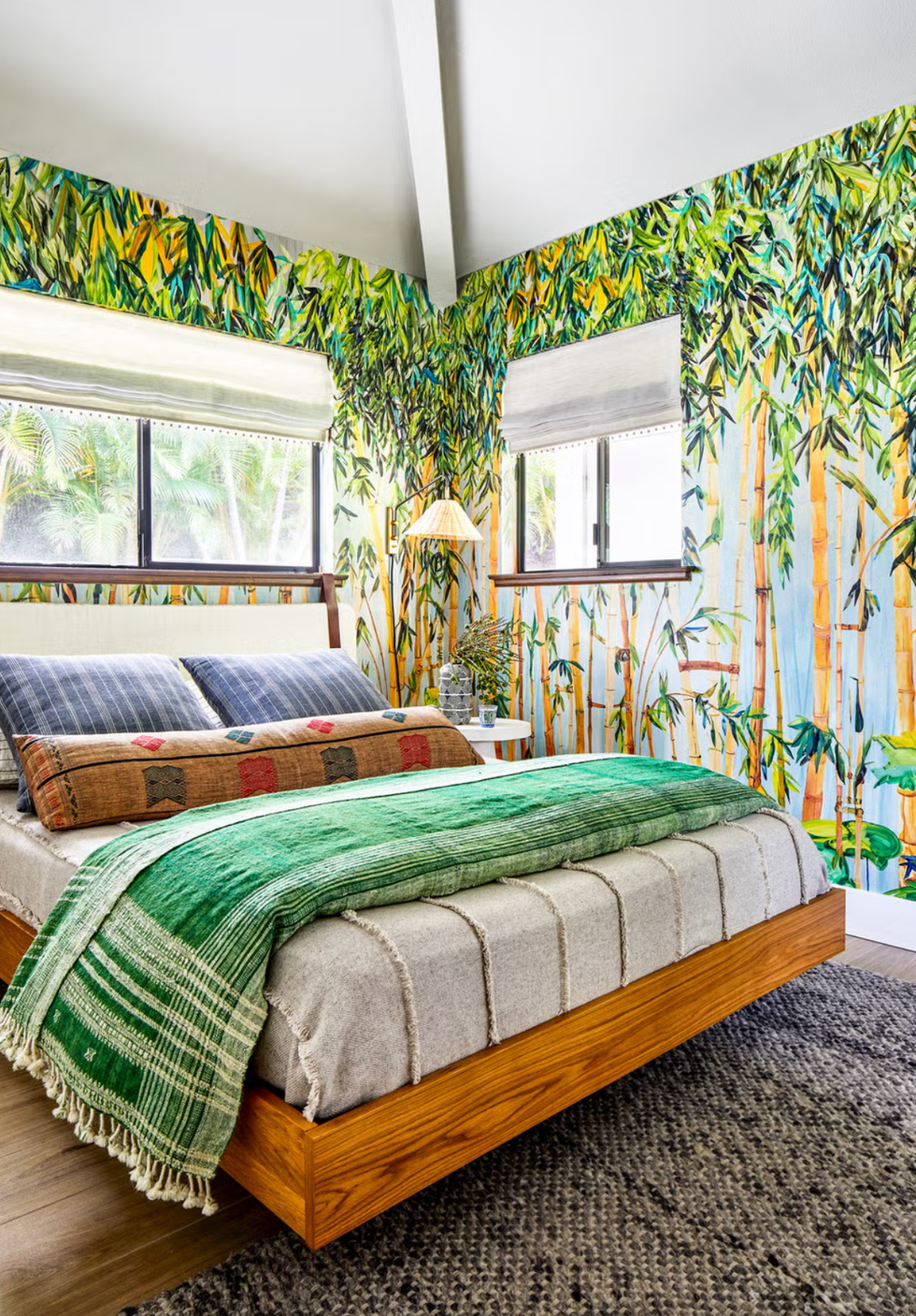 serene bedroom with bamboothemed wallpaper and cozy bedding