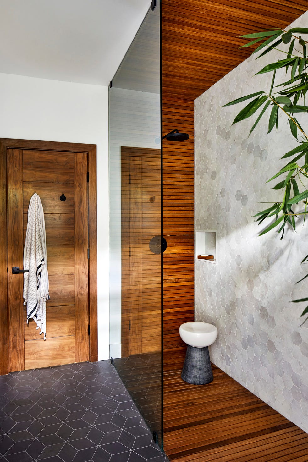 vacation home in maui, hawaii designed by breeze giannasio interiors guest bath with teak wrapped walls, this room opens to the pool area via a connected outdoor shower wall tile tile stool made goods showerhead california faucets floor tile mutina towel hooks signature hardware vacation home in maui, hawaii designed by breeze giannasio interiors guest bath with teak wrapped walls, this room opens to the pool area via a connected outdoor shower wall tile tile stool made goods showerhead california faucets floor tile mutina towel hooks signature hardware