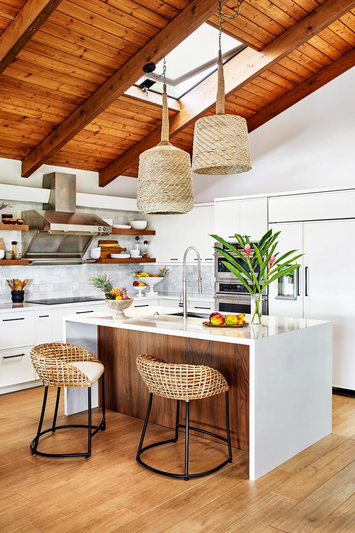 Maui, Hawaii vacation home designed by Breeze Giannasio Interiors with kitchen pendants, Palecek backsplash, tile countertops, Silestone cabinets and hardware, custom refrigerator, freezer and hood, GE Monogram flooring, and Stone Source