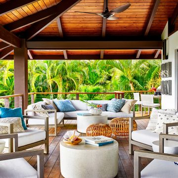 vacation home in maui, hawaii designed by breeze giannasio interiors upper lanai sofa and chairs rh tables crate  barrel ottomans danish design store pillows ciscohome turquoise, rh lumbars, etsy diamond pattern, hollywood at home cream fan circa lighting