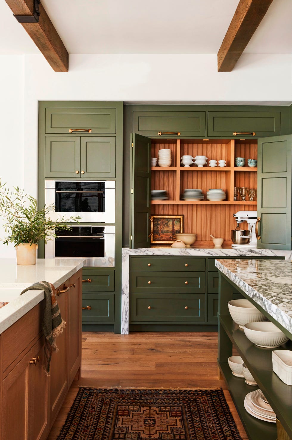 green kitchen with appliance garage