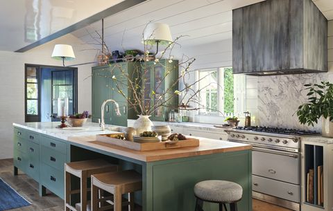 interior designer jeffrey alan marks' american colonial revival home near butterfly beach in montecito, california kitchen cabinetry and knobs plain english paint strong white, farrow  ball walls and white cabinets dripping tap, plain english green cabinets pendant the urban electric co with custom shades faucet waterworks counter stools custom, jam for palecek wood jam for a rudin in rose tarlow range lacanche range hood custom zinc, mainz builders leather pulls custom, richard wrightman