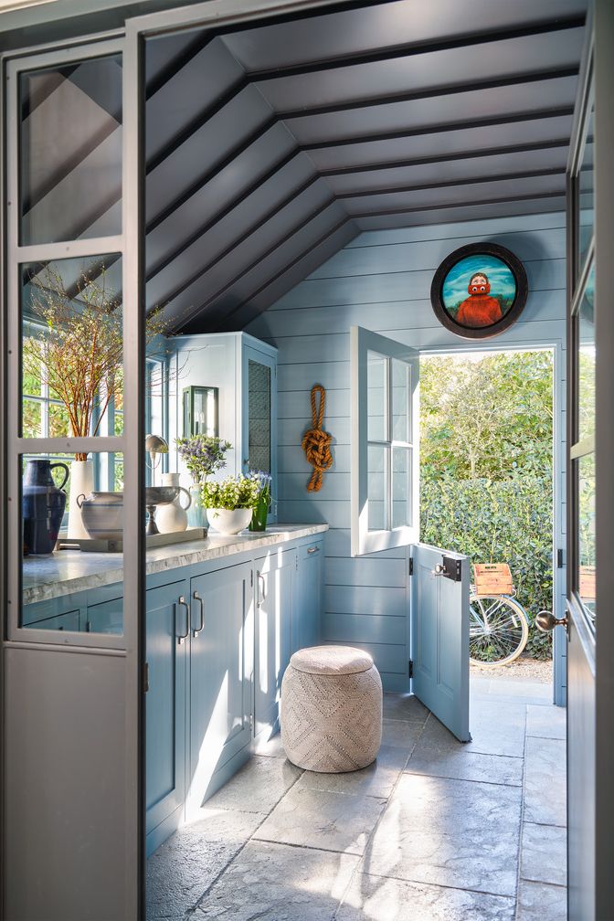 American Colonial Revival home near Butterfly Beach in Montecito, California by interior designer Jeffrey Alan Marks Sand room wall paint Twin Peaks, Portola paint glaze ceiling covering Standing seam Metal roof in a storm Gray Art by Tyson Graham, Antiquated Ottoman Palais Check Floors Exquisite Surfaces