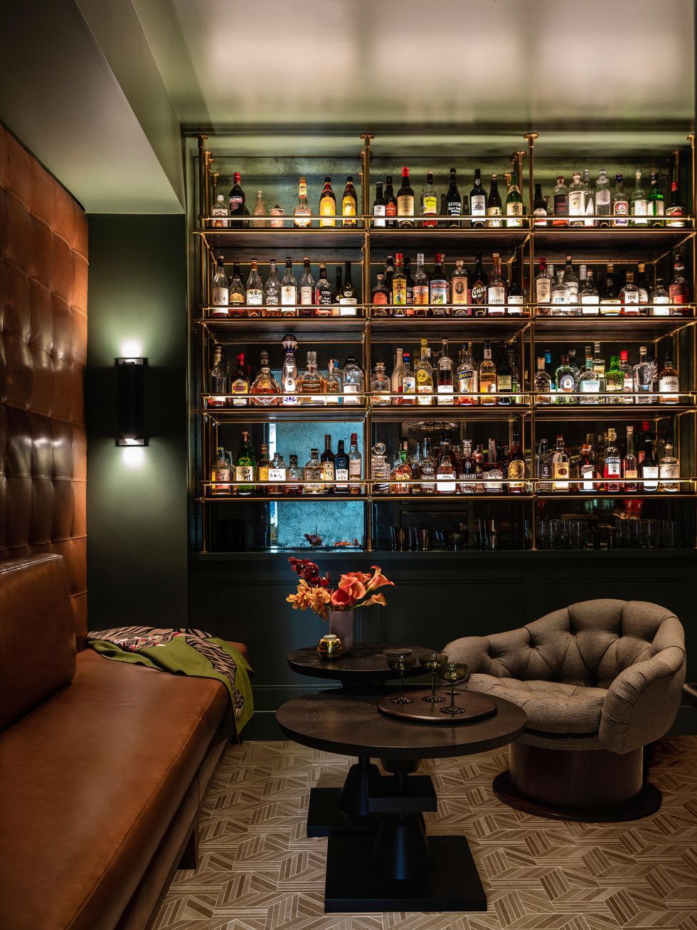 a room with a large shelf of liquor