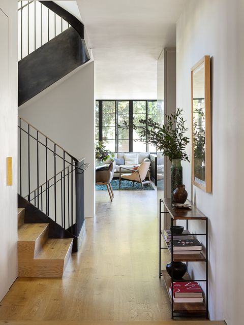 1920s spanish colonial in san francisco designed by regan baker design and landscape architect terremoto stairwell a curved, blackened steel railing climbs all the way up to the roof deck, connecting all levels of the house