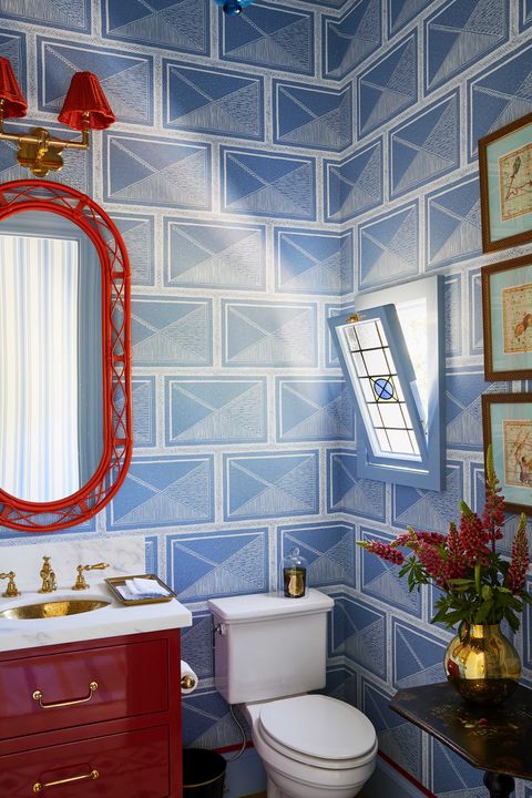 posder room, blue wallpaper, red cabinets, red mirror