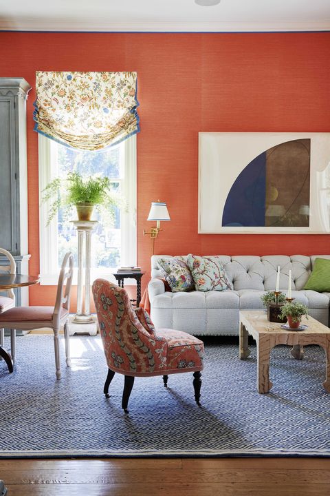 living room, orange wallpaper, white couch