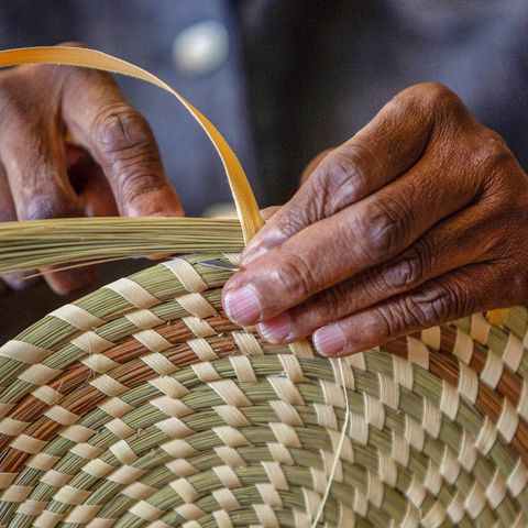 mary jackson weaves a palmetto leaf around sweetgrass while making a lid for a basket in her studio along savannah highway monday may 3, 2021, on johns island, sc jackson learned basketmaking from her mother and grandmother while growing up in the african american community in mount pleasant, sc in time, she expanded beyond the traditional pieces she learned as a child and began crafting her own designs which can be seen in museums across the country