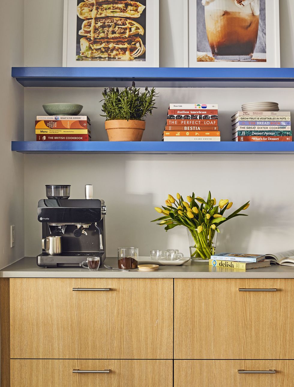 coffee bar with an espresso machine and cookbooks on the shelves