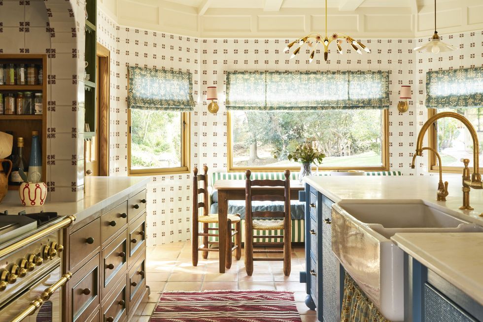 white tiled kitchen with brass pot rail