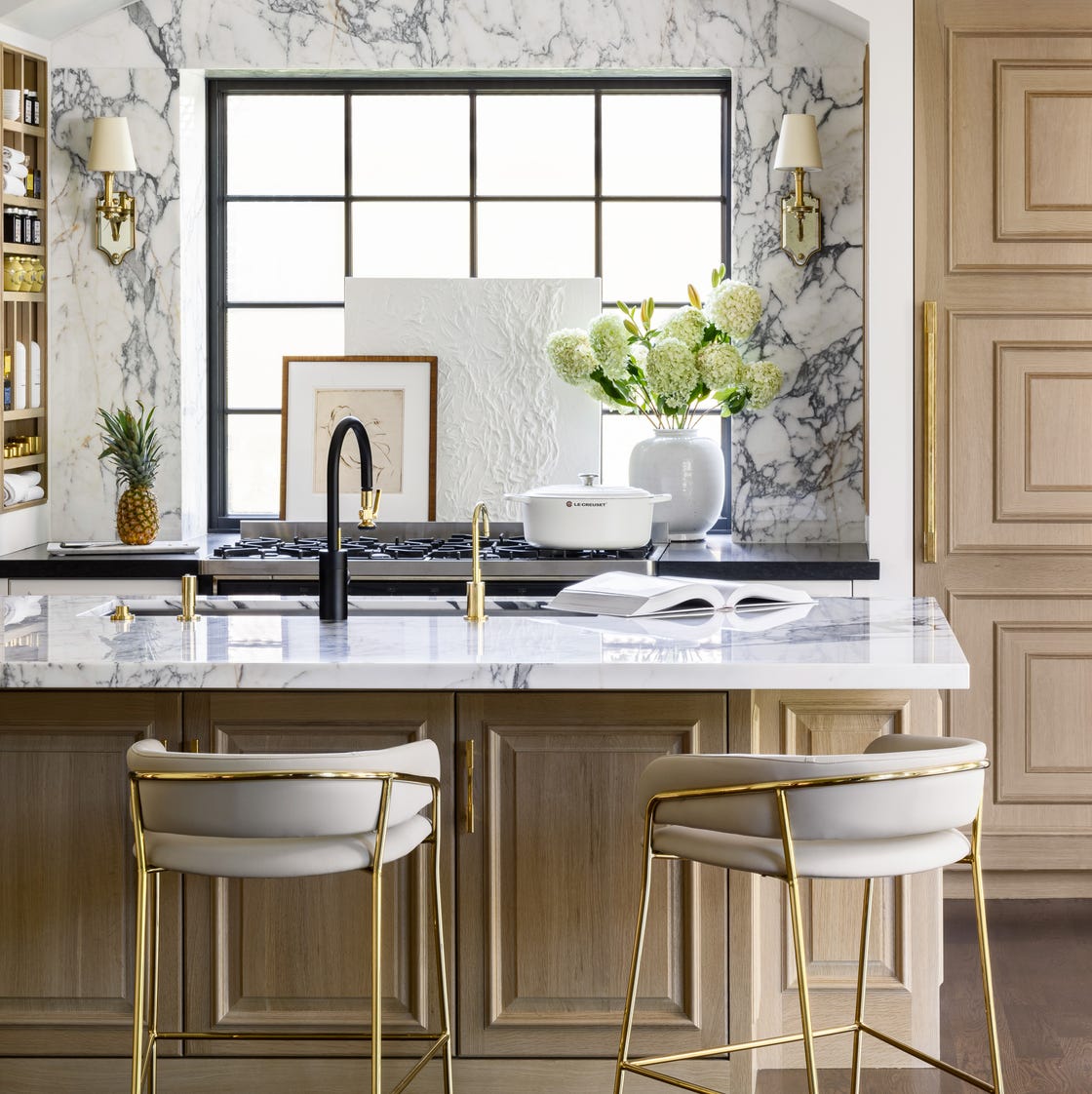 a kitchen with a marble counter top a kitchen with a marble counter top