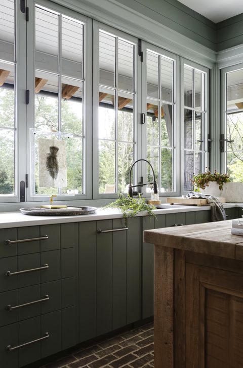 entertaining kitchen a farmhouse kitchen just off the pool area is designed for casual get togethers paint retreat walls and acacia haze trim, sherwin williams faucet brizo island rh countertop caesarstone hardware top knobs