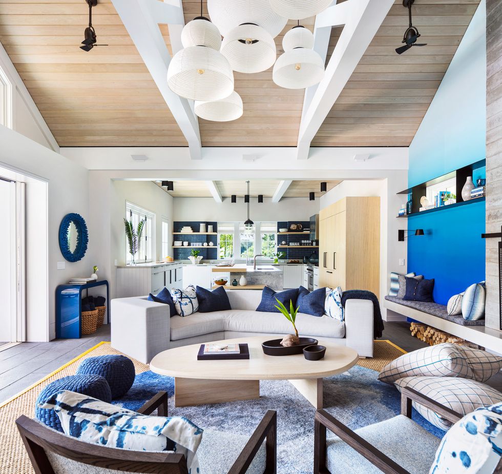 warm surfaces “ceilings are often the forgotten plane,” says berman his team placed wide panels of white oak along the ceilings, then punctuated them with slim black canister lights over task areas sofa and coffee table custom, workshopapd, fabricated by naula wallcovering calico