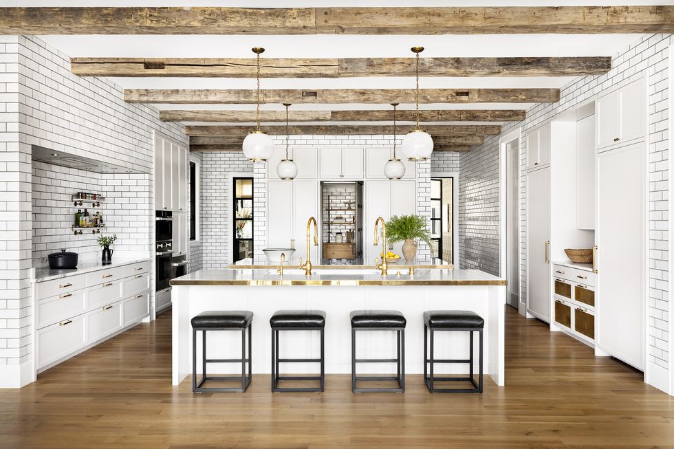 white subway tile kitchen with two islands