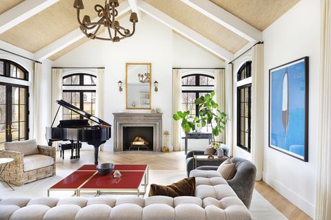 neutral living room with fireplace and piano