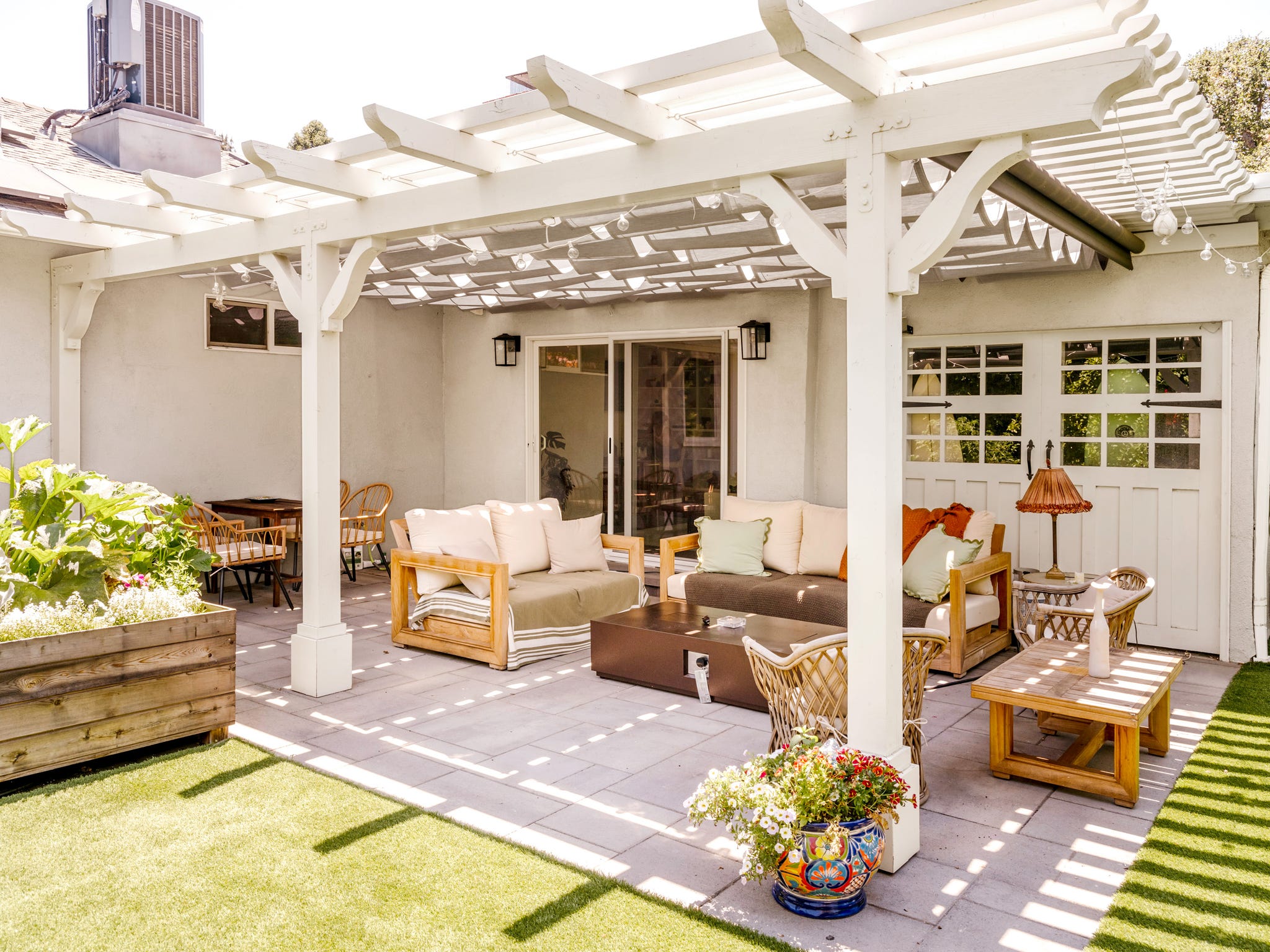 an outdoor living room on a patio and furniture