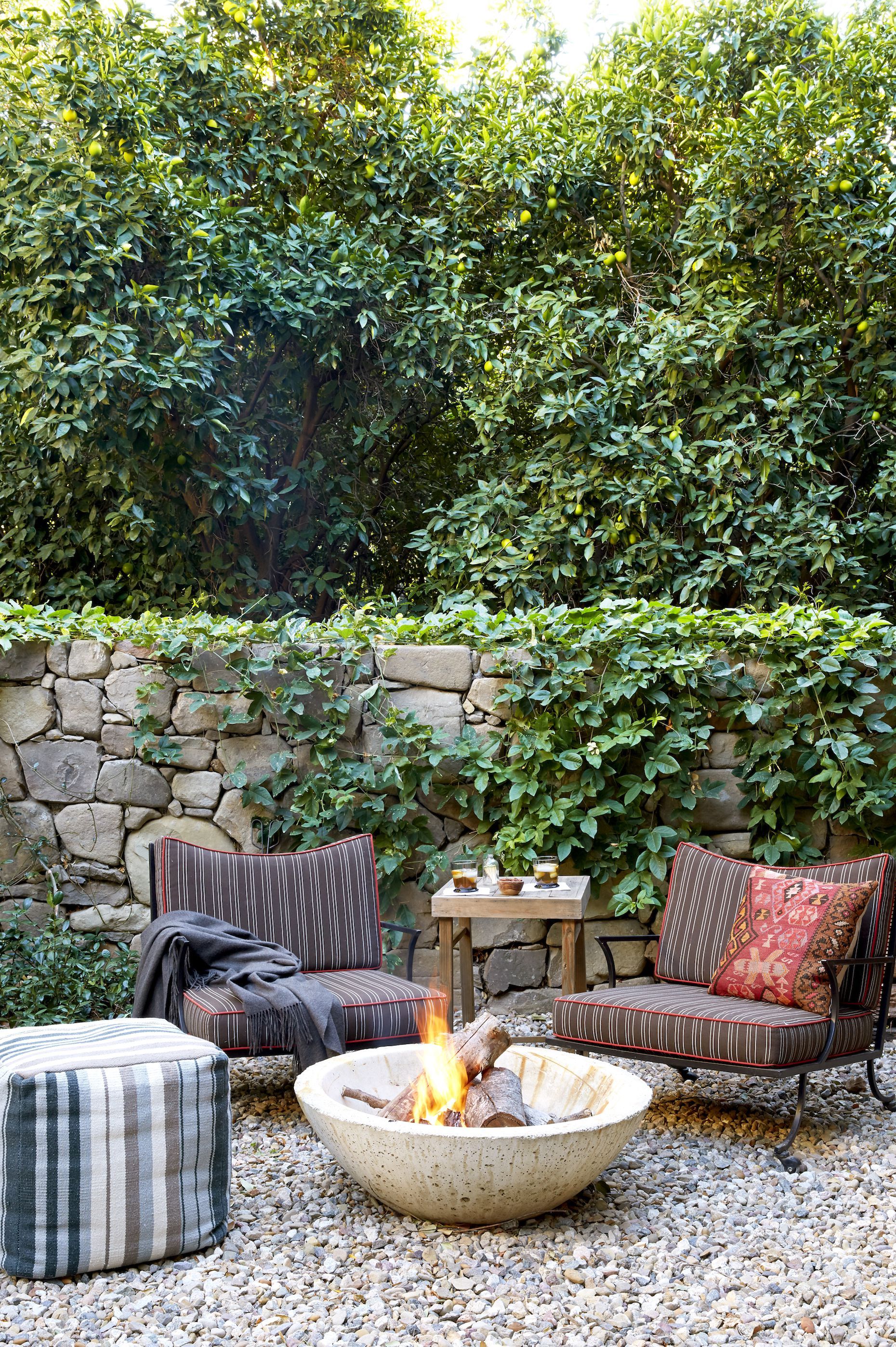 Table and chairs with fire pit in the online middle